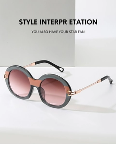 Macro shot of stylish two-tone round frames with gradient lenses and metal temples