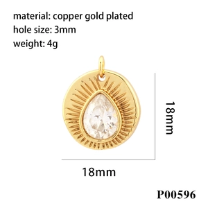 Golden sunburst pendant in copper gold plating with a central teardrop gemstone