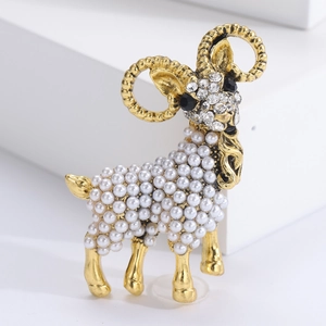 Elegant gold sheep brooch featuring white pearls and sparkling crystal embellishments