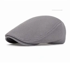 Detailed side view of the breathable light gray mesh fabric on an ivy flat cap