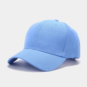 Detail of light blue cotton twill baseball cap showing fabric texture and stitching