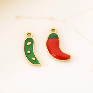 Detailed view of red and green chili pepper charms with gold-plated edges for DIY jewelry