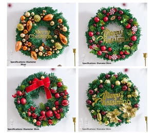 Detail of Christmas wreath with pine cones ornaments and festive red ribbon 38cm