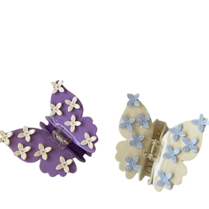 Elegant butterfly hair claws with 3D flowers and rhinestones in purple and beige tones