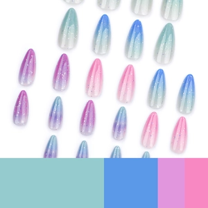Colorful gradient stiletto press-on nails with glitter and sequins on white background