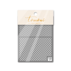 Detail of vintage white checkered nail stickers with thin and flexible texture on packaging