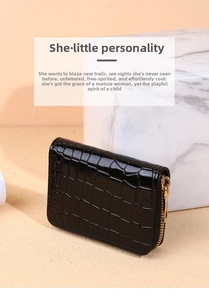 Detail of black crocodile texture leather wallet with gold metal zipper and mini size