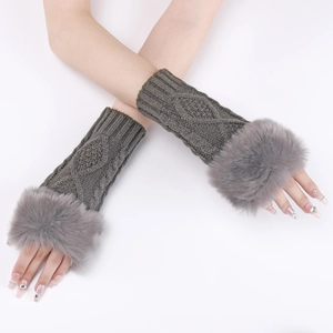 Detail of dark grey cable knit arm warmer with plush faux fur trim and fingerless cuff