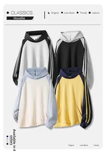 Detail view of multi-color raglan hoodies featuring striped sleeves and kangaroo pockets