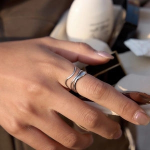 Polished silver multilayer wave ring for women with minimalist stacked design on hand