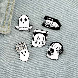 5-piece cartoon ghost enamel pin set on denim background with musical and gothic designs