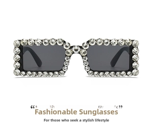 Macro detail of square sunglasses featuring full sparkling rhinestone-encrusted frame