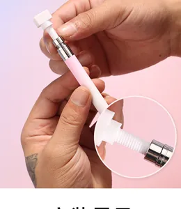 Detail showing hand rotating the pink and white nail art dotting tool with threaded joint