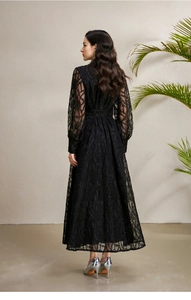 Detailed back view of black lace maxi dress with palace style lantern sleeves and embroidery