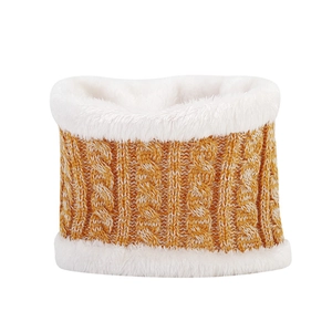Detail of ginger yellow cable knit scarf with soft plush white faux fur lining texture