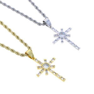 Detail of hip hop style cross pendants in gold and silver finish with zircon stones
