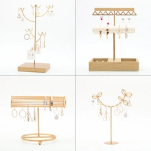 Golden jewelry display stands with bamboo base for rings and earrings in various designs