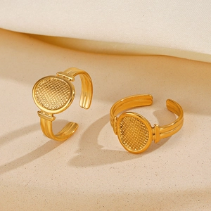 Minimalist matte gold oval geometric ring with square grid pattern and open design