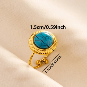 Detail shot of golden open ring with blue turquoise stone and size measurements