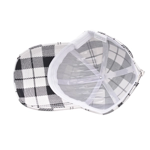 Inside view of thick houndstooth baseball cap with white sweatband and material labels