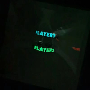 Luminous Player 1 and Player 2 rings glowing with blue-green neon light in the dark