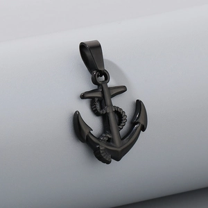 Detailed macro view of a black anchor pendant with nautical rope design and metallic finish