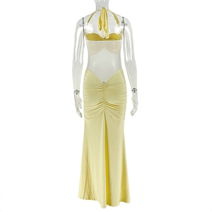 Detail of yellow backless halter maxi dress with ruched fabric and slim fit design