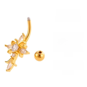Macro detail of golden navel ring featuring a zircon inlaid cross and floral lace pendant