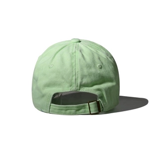 Detail of mint green cotton baseball cap showing adjustable metal buckle and strap