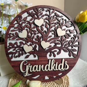Detail of wooden Grandkids tree plaque with heart accents and rustic texture finish