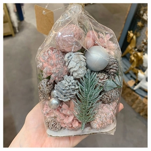 Christmas DIY decoration kit with pink and silver pine cones, baubles and pine needles