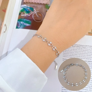 Detail of silver S925 hollow petal link bracelet with adjustable chain and teardrop charm