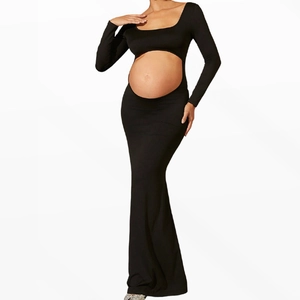 Sexy black maternity maxi dress with waist cutout and long sleeves for a slim fit look
