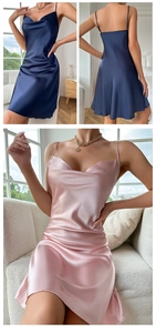Detail of satin slip nightdress with V-neckline and smooth silk texture in navy and pink
