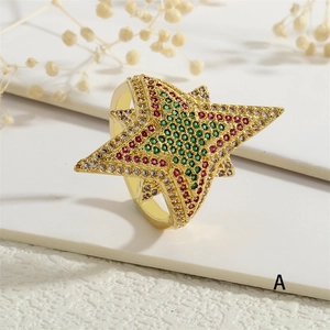 Detailed view of 18K gold star ring with multi-colored crystals and zircon inlay