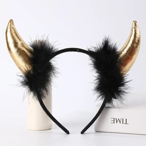 Detail of gold devil horns headband with black feathers for Halloween party costume