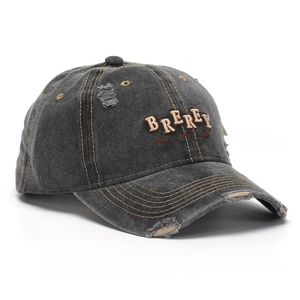 Close-up of distressed gray baseball cap with BREREY embroidery and vintage frayed details