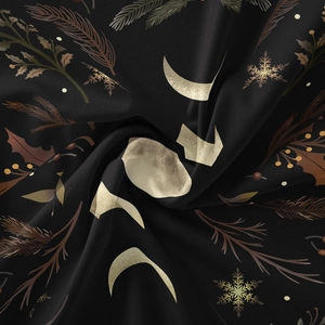 Macro detail of moon phases and pine needle prints on soft bohemian tapestry fabric
