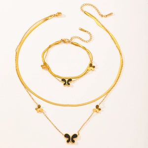 Detail of 18k gold plated stainless steel butterfly pendant necklace and bracelet set