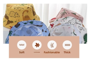 Detail of baby sun hats with cartoon dinosaur prints and adjustable windproof chin straps