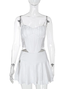 Detail of white lace patchwork corset top and high-waisted pleated skirt set for women