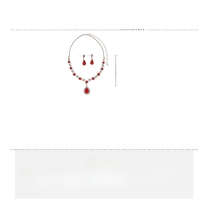 Detailed view of luxury red teardrop jewelry set with necklace and drop earrings