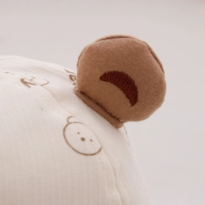 Close-up of cute bear ear detail and soft cotton fabric on baby sun protection hat