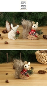 Detail of Christmas squirrel ornaments with sisal fur, pine cones and red berries