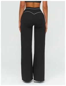 Detail of high waisted wide leg sports pants with white stripes and V-shaped seam