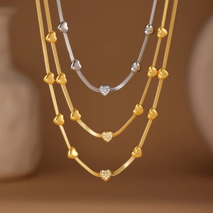 Elegant gold and silver snake chain necklaces with pavé heart pendants for women