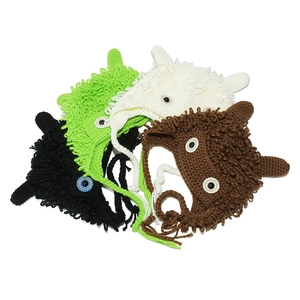 Detailed view of handmade crochet monster hats with fluffy texture and cute large eyes