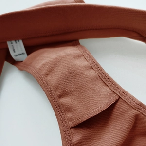 Women's low-waisted cotton sports briefs in brick red with elastic wide waistband