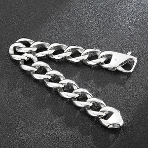 Close-up of polished silver steel curb chain bracelet with heavy duty lobster clasp