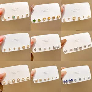 Detailed grid view of assorted S925 silver needle pearl bow earrings and stud sets